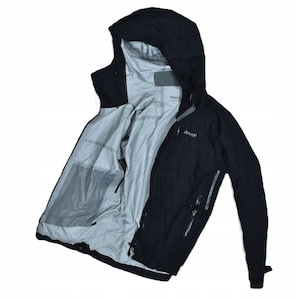 May include: Black hooded jacket with a light gray interior. The jacket has a zipper closure, multiple pockets, and the brand name "Bergans" is visible on the chest. The jacket is designed for outdoor activities.