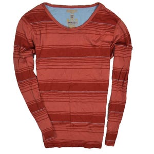 May include: A long-sleeved, V-neck shirt in shades of red and orange with horizontal stripes. The shirt has a light blue neckline and a tag attached near the collar. The garment is made of a soft, lightweight material.