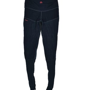 May include: Dark navy leggings with a high waistband and a small red triangle logo. The leggings have a textured appearance and feature stitching details. The word "DEVOLD" is printed in red on the left leg.