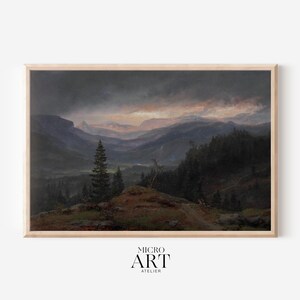 May include: A framed painting depicting a dark, moody landscape with a mountain range in the distance. The sky is overcast with a hint of orange and pink in the clouds. The foreground features a group of trees in the forest.