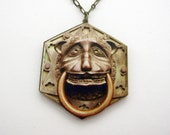 The mournful lion dook knocker necklace