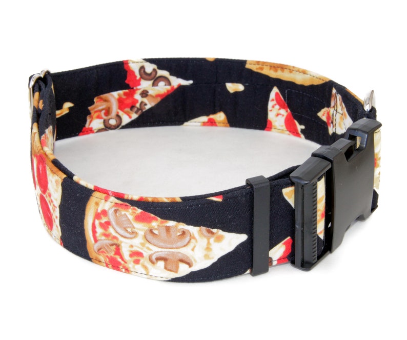 May include: Black dog collar with a pizza slice pattern. The collar has a black plastic buckle.