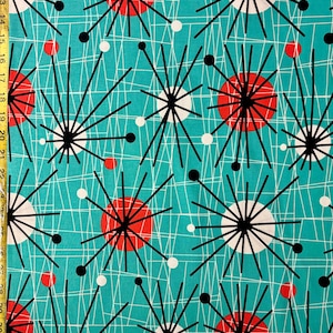 May include: Teal fabric with a repeating pattern of black, white, and red geometric shapes. The shapes are stylized stars with radiating lines and circles.