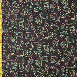 May include: A black fabric with a repeating pattern of neon-colored video game controllers and handheld game consoles. The pattern includes yellow, green, pink, and blue.