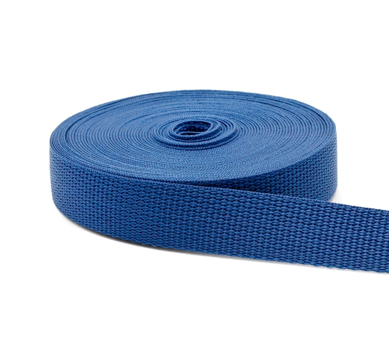May include: A roll of blue webbing, a type of strong, woven fabric often used for straps and belts.