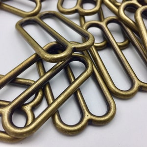 50 Pieces - Tri-Glide Slides - 1 inch, 1.5 inch, 2 inch Nickel & Antique Brass