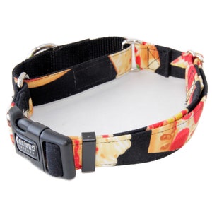 May include: A black and red dog collar with a pizza print. The collar has a black buckle with the word "Canine" printed on it.