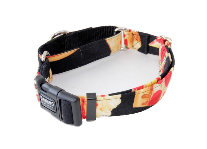 May include: A black and red dog collar with a pizza print. The collar has a black buckle with the word "Canine" printed on it.