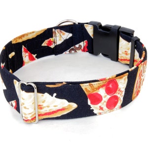 May include: Black dog collar with a pizza print. The collar has a silver buckle and a black plastic buckle.
