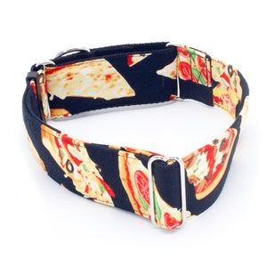 May include: A black dog collar with a pizza print. The collar has silver metal hardware.