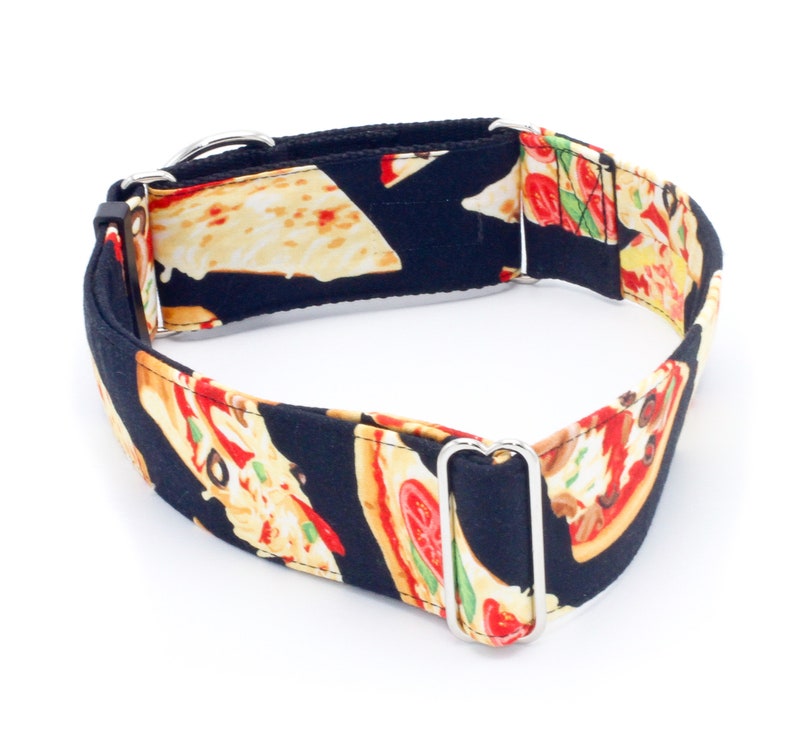 May include: A black dog collar with a pizza print. The collar has silver metal hardware.