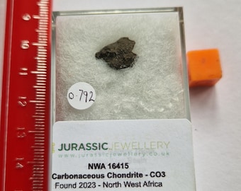 Carbonaceous Chondrite  Meteorite -ULTRA RARE Meteorite Type - NWA 16415 -  - Boxed and Certificated  -  0.792 Grams