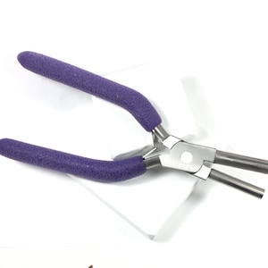 May include: Purple handled pliers with a silver metal head and two prongs. The pliers are designed for jewelry making.