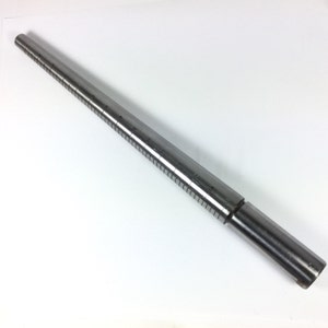May include: A silver metal ring sizer with numbered markings. The sizer is a long, tapered tool used to measure finger size.
