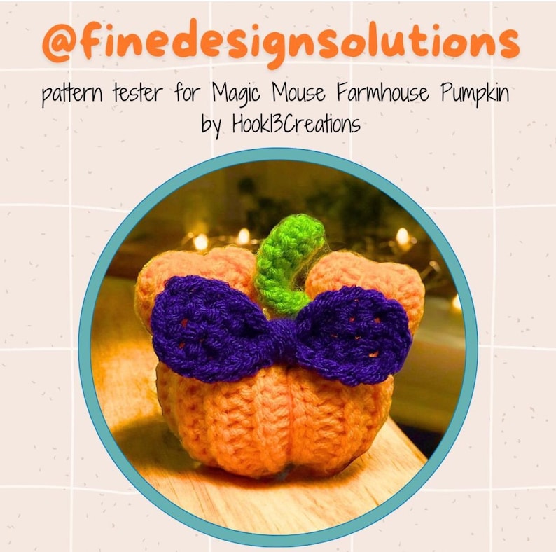 May include: A crocheted pumpkin with a purple bow and green stem. The pumpkin is orange and the bow is a dark purple. The stem is a bright green. The pumpkin is sitting on a wooden surface. The text "pattern tester for Magic Mouse Farmhouse Pumpkin by Hookl3Creations" is above the pumpkin.