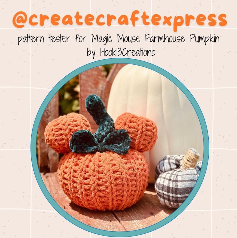 May include: A crocheted orange pumpkin shaped like Mickey Mouse with a green velvet stem. The pumpkin is sitting on a wooden surface next to a white pumpkin and a plaid pumpkin.