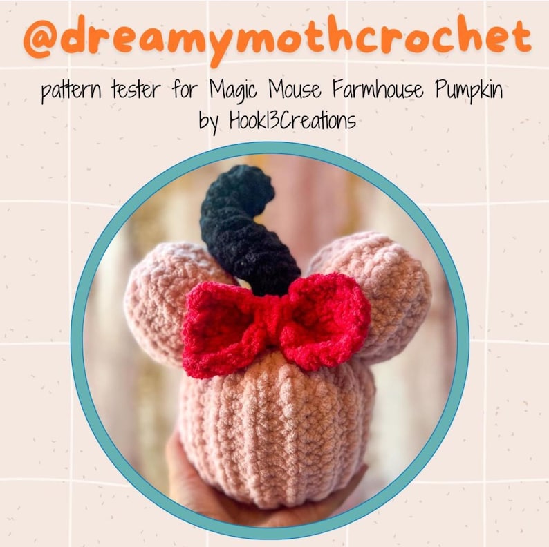 May include: A pink crocheted pumpkin with a black crocheted stem and a red bow. The pumpkin is shaped like Mickey Mouse's head. The image is captioned "pattern tester for Magic Mouse Farmhouse Pumpkin by Hook13Creations".