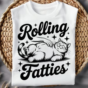 May include: White t-shirt with a black and white illustration of a cat with the text "Rolling Fatties".