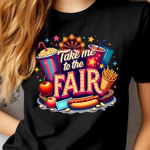 May include: Black t-shirt with a colorful graphic design featuring a Ferris wheel, popcorn, a hot dog, french fries, and a drink. The text on the shirt reads "Take me to the Fair".