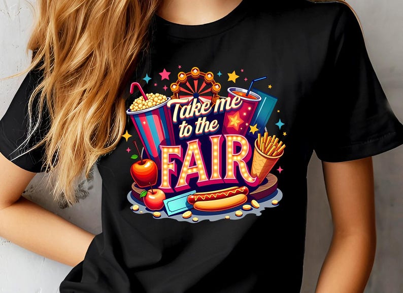 May include: Black t-shirt with a colorful graphic design featuring a Ferris wheel, popcorn, a hot dog, french fries, and a drink. The text on the shirt reads "Take me to the Fair".