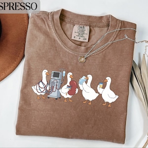Funny Duck T-Shirt for Nurses, Cute Healthcare Worker Gift Shirt, Medical Ducks Graphic Tee, Nurse Appreciation Top, Quirky Nurse T-Shirt