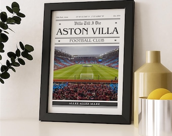 May include: A black framed print of Aston Villa Football Club. The print includes the text "Villa Till I Die" and "Aston Villa Football Club." The image shows a stadium filled with fans and a green pitch. The words "ALLEZ ALLEZ ALLEZ" are at the bottom.