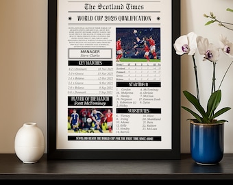 May include: A framed print of a newspaper page titled "The Scotland Times" with the headline "World Cup 2026 Qualification." The print includes match details, team lineups, and the text "Scotland Reach the World Cup for the First Time Since 1998!"
