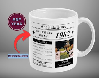 May include: White ceramic mug with a newspaper design featuring the text "The Villa Times" and "Scott was born 15th May! 1982". The mug has a black handle and a photo of a soccer player holding a trophy.