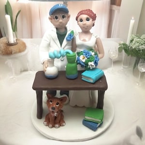 Bride and groom with pet  Science themed wedding cake topper custom made to resemble you by Lynn’s Little Creations