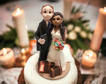 Travel themed wedding cake topper figures with bride and groom custom made by Lynn’s Little Creations