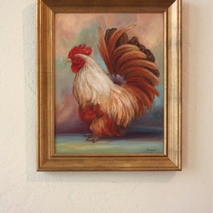 May include: A painting of a rooster with a red comb and wattles, white and brown feathers, and a long, flowing tail. The rooster is standing on a blue surface with a light brown background.