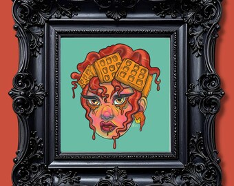 May include: A square art print in a black ornate frame featuring a stylized illustration of a person with wavy red hair adorned with golden waffles. The figure has melting syrup dripping from their hair and chin against a solid teal background.