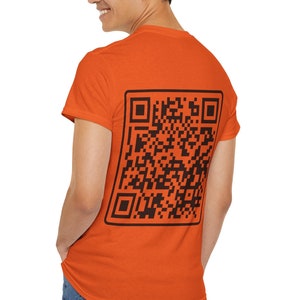May include: A bright orange t-shirt with a black QR code printed on the back.