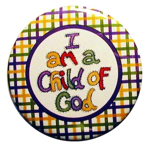 May include: A round button with a checkered pattern in shades of green, yellow, and purple. The center of the button features a white circle with the text "I am a child of God" in colorful, outlined letters.