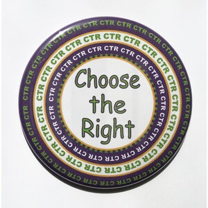 May include: A round button with a purple, gold, and green border. The center of the button is white with the text "Choose the Right" in green.