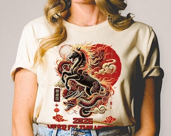 May include: Cream-colored t-shirt featuring a black horse with fiery red mane and tail, rising above a red dragon. The design includes a red sun, clouds, and the text "2026 YEAR OF THE HORSE" in white. Chinese characters are also present.