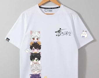 May include: White t-shirt featuring a stack of cartoon characters with cat ears. The shirt has Japanese text and a small cartoon bunny on the right side. A small logo is on the left sleeve.