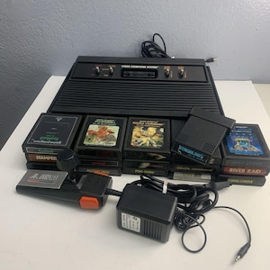 Atari 2600 System Bundle with Console, 16 Games, Joystick, Paddles, and More LOT