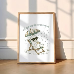 May include: A framed print featuring a cartoon sheep wearing sunglasses and relaxing in a beach chair under an umbrella. The sheep is holding a cup, with the text "well cymraeg slac na saesneg stic" above the image.