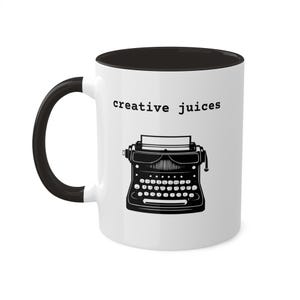 May include: White ceramic mug with a black interior and handle. The mug features a black and white illustration of a vintage typewriter with the text "creative juices" printed above it.