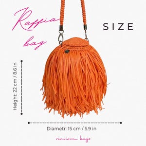 May include: An orange raffia bag with a fringed exterior, a circular lid, and a braided shoulder strap. Text includes "Raffia bag", "SIZE", "Height: 22 cm / 8.6 in", "Diametr: 15 cm / 5.9 in", and "remnova bags". The bag features silver-tone hardware.