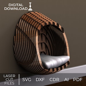 May include: A wooden, wall-mounted cat bed with a layered design, featuring a curved, enclosed shape. It contains a light-coloured cushion. The image includes the text "DIGITAL DOWNLOAD" and "LASER CUT FILES" with file type options: SVG, DXF, CDR, AI, and PDF.