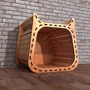 May include: A wooden storage bin with a curved design and a slatted front. The bin is made of light brown wood and has a decorative dashed line around the edges. The bin is placed on a wooden floor against a brick wall.