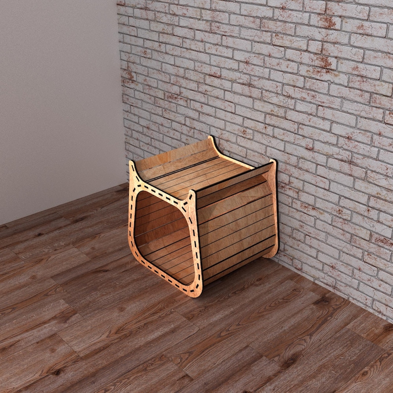 May include: A wooden pet bed with a rounded opening and a slatted top. The bed is made of light-colored wood and has a stitched design around the opening. The bed is placed against a brick wall.