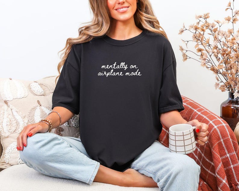 Comfort Colors 1717 t-shirt with the text “Mentally on Airplane Mode”, minimal travel-themed design. Funny airplane mode shirt for travel lovers, airport outfits, vacations, flights, introverts, and everyday casual wear.