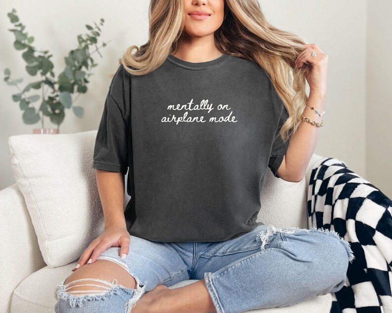 Comfort Colors 1717 t-shirt with the text “Mentally on Airplane Mode”, minimal travel-themed design. Funny airplane mode shirt for travel lovers, airport outfits, vacations, flights, introverts, and everyday casual wear.