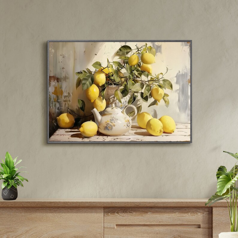 May include: A still life painting of a white teapot with floral designs and lemons on a branch. The lemons are yellow and green and are arranged in a vase. The background is a light blue and white.