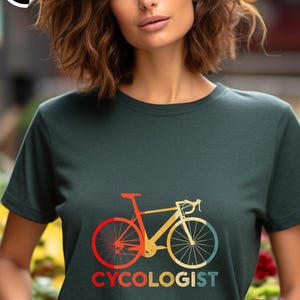 May include: A dark green t-shirt with a vintage-style illustration of a bicycle and the text "CYCOLOGIST".