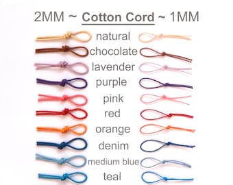 May include: A selection of 14 cotton cords in various colors, including natural, chocolate, lavender, purple, pink, red, orange, denim, medium blue, teal, olive, bright green, and black. The cords are 2 mm and 1 mm in diameter.