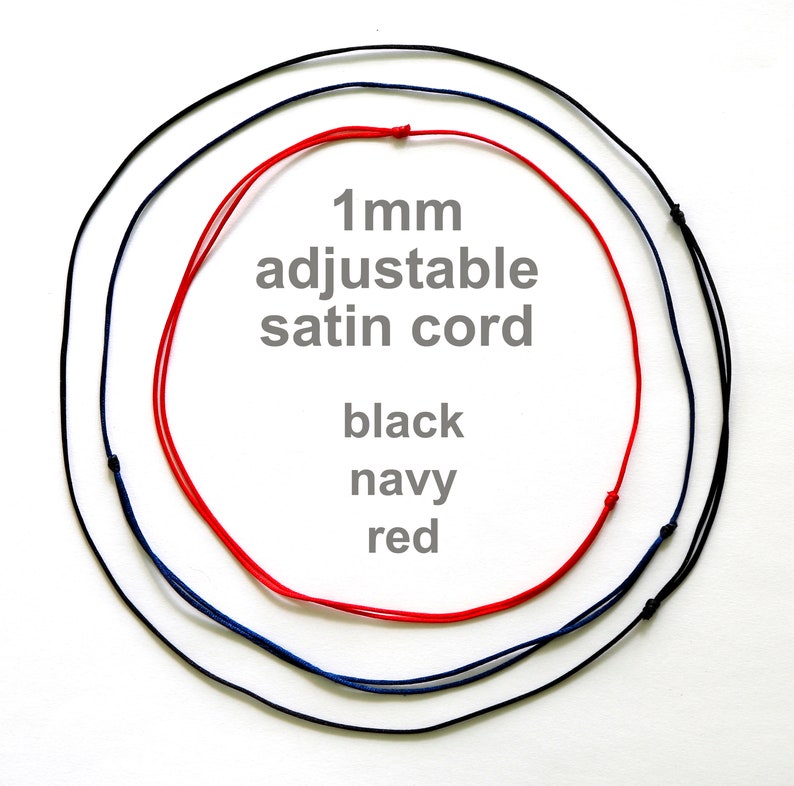 May include: Three 1 mm adjustable satin cords in black, navy, and red.